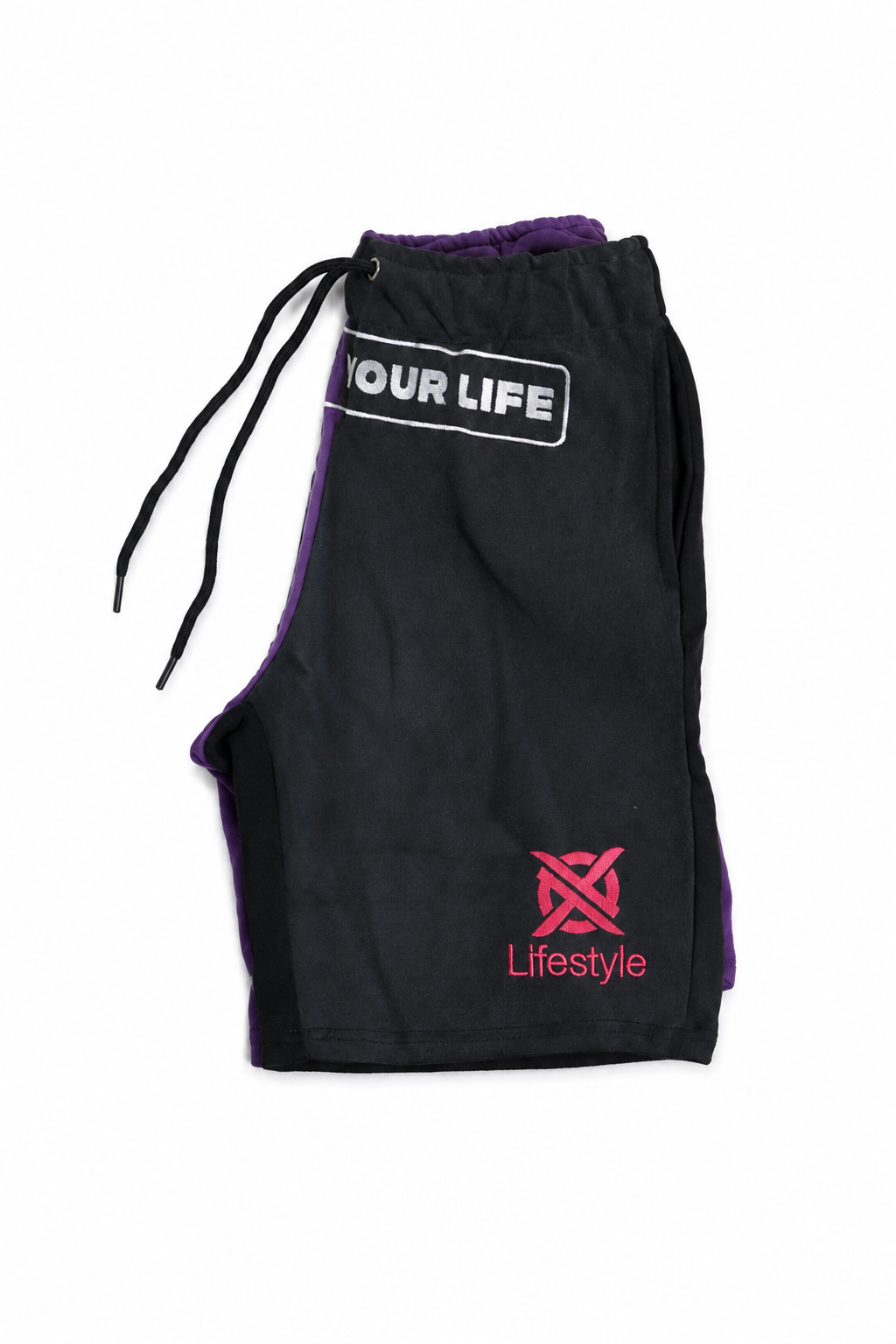Black athletic shorts with purple side panels and a black drawstring, featuring a white graphic on the right leg that reads 'YOUR LIFE' and a pink 'Lifestyle' logo on the left leg.